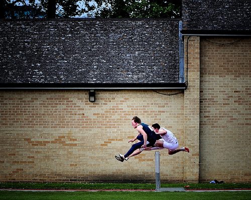 jump hurdles of roadblocks - photo of hurdlers jumping hurdle